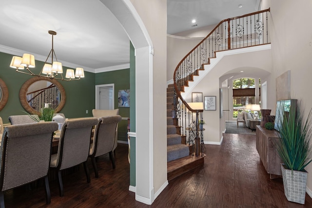 1817 Foxborough Trl, Flower Mound, TX 75028 - entrance foyer featuring arched walkways, stairs, a chandelier, wood finished floors, and ornamental molding