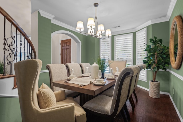 1817 Foxborough Trl, Flower Mound, TX 75028 - dining area featuring arched walkways, a chandelier, wood finished floors, baseboards, and ornamental molding