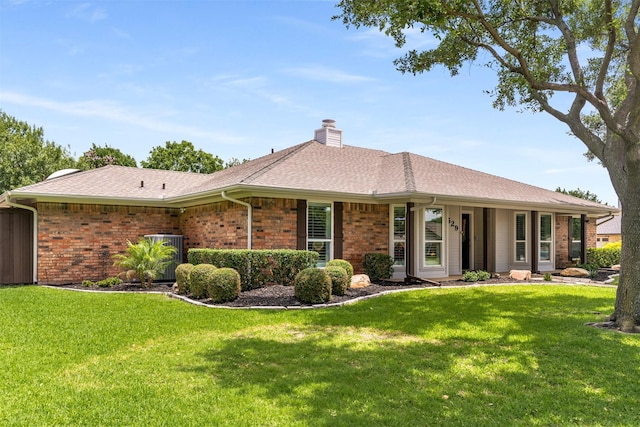529 Doubletree Dr, Highland Village, TX 75077 - view of front of property with a front yard, a chimney, brick siding, and roof with shingles