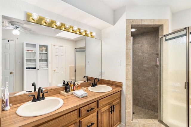 529 Doubletree Dr, Highland Village, TX 75077 - bathroom featuring a shower stall, double vanity, and a ceiling fan
