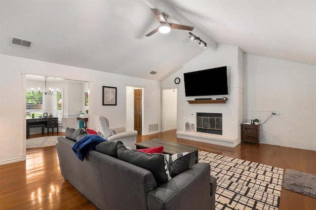 529 Doubletree Dr, Highland Village, TX 75077 - living area with wood finished floors, a large fireplace, a chandelier, a ceiling fan, and baseboards