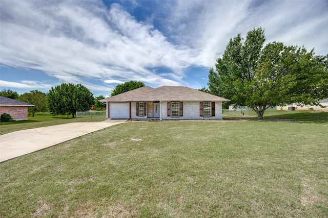505 W Thomas St, Leonard, TX 75452 - ranch-style home featuring concrete driveway, an attached garage, and a front lawn