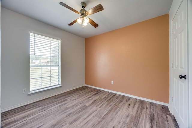 505 W Thomas St, Leonard, TX 75452 - unfurnished room with light wood-style floors, ceiling fan, and baseboards
