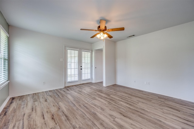 505 W Thomas St, Leonard, TX 75452 - spare room with french doors, healthy amount of natural light, and wood finished floors