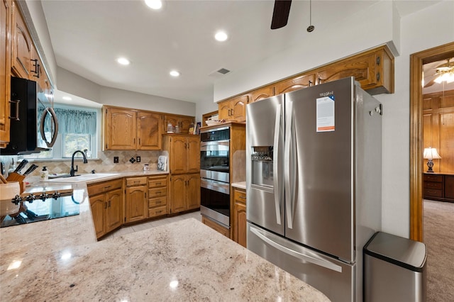 2818 Summit Ridge St, Grapevine, TX 76051 - kitchen with appliances with stainless steel finishes, a ceiling fan, a sink, decorative backsplash, and recessed lighting