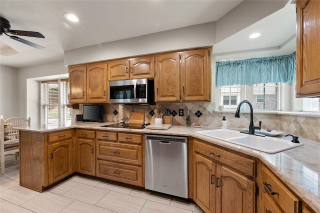 2818 Summit Ridge St, Grapevine, TX 76051 - kitchen featuring appliances with stainless steel finishes, a sink, a ceiling fan, plenty of natural light, and recessed lighting