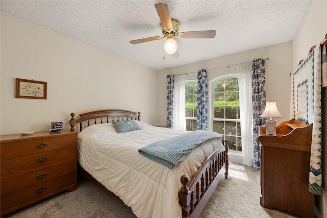 2818 Summit Ridge St, Grapevine, TX 76051 - carpeted bedroom with a textured ceiling and ceiling fan