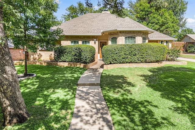 2818 Summit Ridge St, Grapevine, TX 76051 - french country style house featuring roof with shingles, brick siding, and a chimney