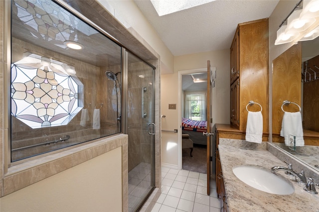 2818 Summit Ridge St, Grapevine, TX 76051 - full bathroom featuring tile patterned floors, a shower stall, vanity, ensuite bathroom, and a skylight