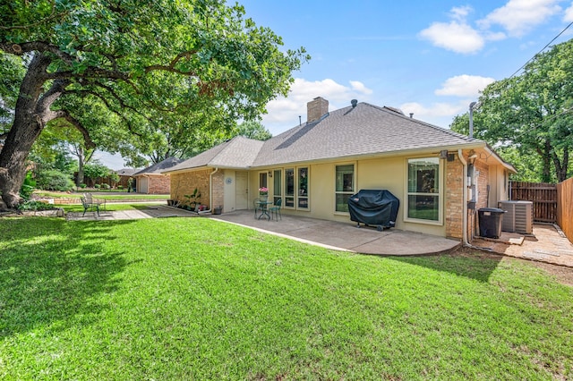 2818 Summit Ridge St, Grapevine, TX 76051 - back of house with a chimney, a patio, central air condition unit, a shingled roof, and brick siding