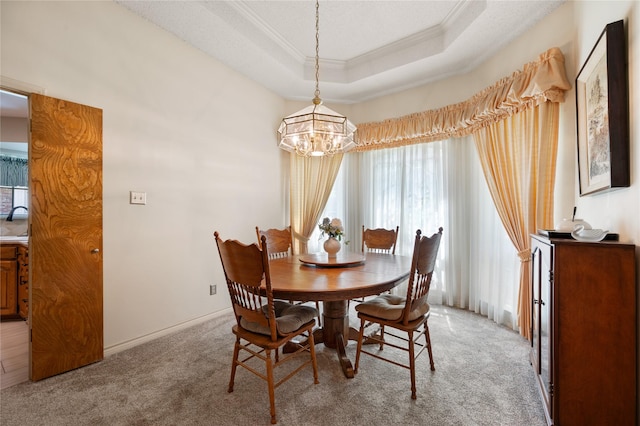 2818 Summit Ridge St, Grapevine, TX 76051 - carpeted dining area with ornamental molding, a chandelier, and a raised ceiling