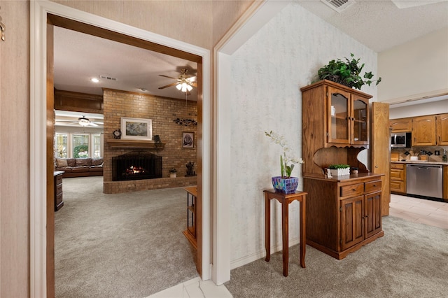 2818 Summit Ridge St, Grapevine, TX 76051 - hallway featuring light colored carpet, a textured ceiling, light tile patterned floors, and wallpapered walls