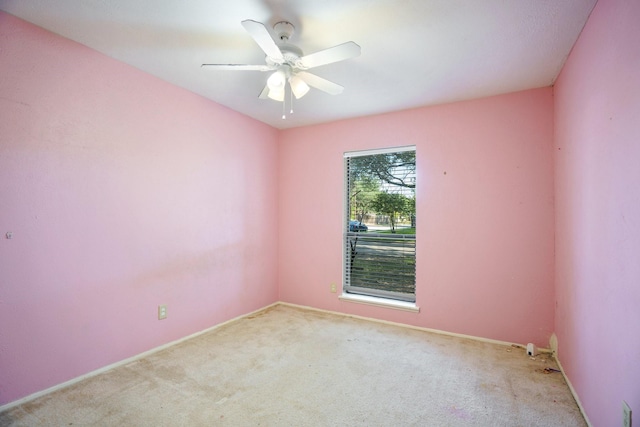 745 Oakland St, Grand Prairie, TX 75052 - spare room featuring carpet, ceiling fan, and baseboards