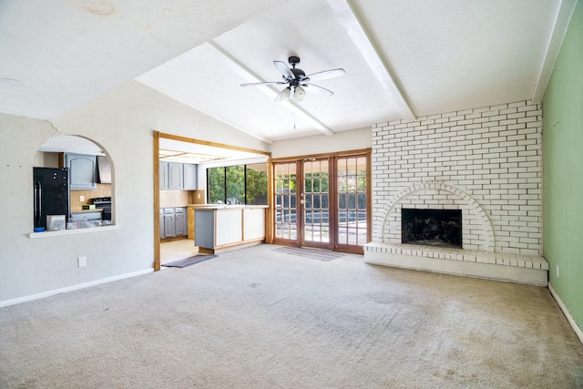 745 Oakland St, Grand Prairie, TX 75052 - unfurnished living room featuring carpet, a ceiling fan, baseboards, and a fireplace