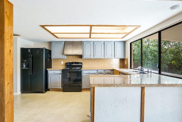 745 Oakland St, Grand Prairie, TX 75052 - kitchen with black appliances, a sink, gray cabinets, and backsplash