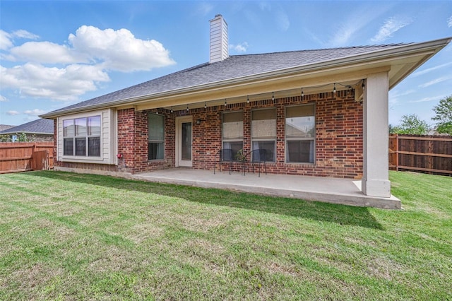 1414 Fox Glen Trl, Mansfield, TX 76063 - back of property featuring brick siding, a patio area, and a chimney