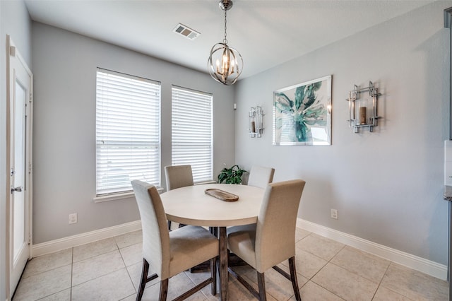 1317 Roadrunner Dr, Little Elm, TX 75068 - dining area with a chandelier, light tile patterned floors, and baseboards