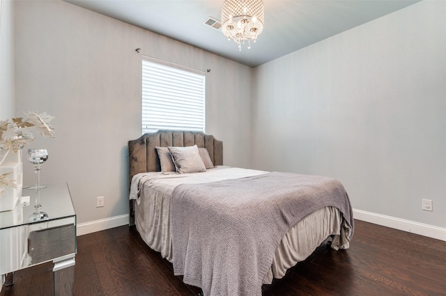 1317 Roadrunner Dr, Little Elm, TX 75068 - bedroom featuring a chandelier, baseboards, and wood finished floors