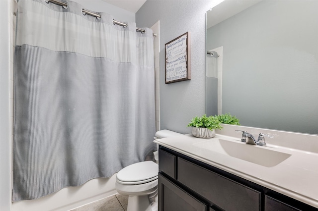 1317 Roadrunner Dr, Little Elm, TX 75068 - bathroom with toilet, vanity, shower / bath combination with curtain, tile patterned floors, and a textured wall
