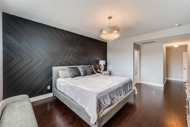 1317 Roadrunner Dr, Little Elm, TX 75068 - bedroom featuring a chandelier, dark wood-style flooring, and baseboards