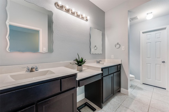 1317 Roadrunner Dr, Little Elm, TX 75068 - full bath featuring double vanity, toilet, tile patterned floors, and baseboards