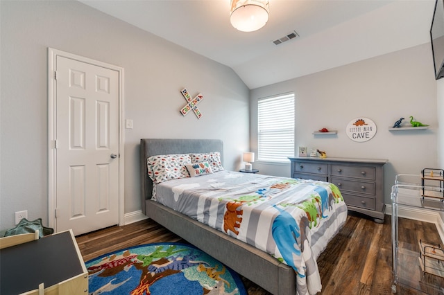 1317 Roadrunner Dr, Little Elm, TX 75068 - bedroom with dark wood-type flooring, lofted ceiling, and baseboards