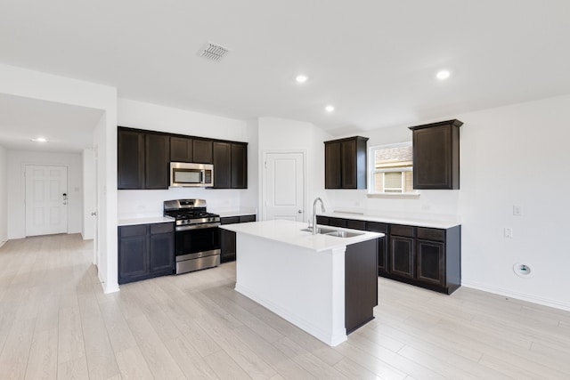 1932 Coleto Rd, Crandall, TX 75114 - kitchen featuring appliances with stainless steel finishes, a sink, light wood finished floors, light countertops, and recessed lighting