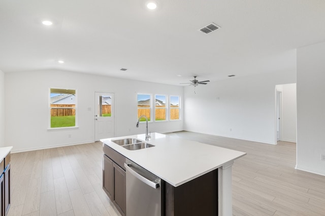 1932 Coleto Rd, Crandall, TX 75114 - kitchen with stainless steel dishwasher, a sink, open floor plan, light countertops, and recessed lighting