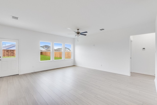 1932 Coleto Rd, Crandall, TX 75114 - unfurnished living room with ceiling fan, light wood-style flooring, and baseboards