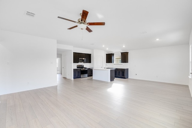 1932 Coleto Rd, Crandall, TX 75114 - unfurnished living room featuring a sink, a ceiling fan, light wood-style floors, recessed lighting, and baseboards