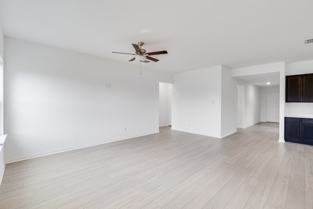 1932 Coleto Rd, Crandall, TX 75114 - unfurnished living room with light wood finished floors, a ceiling fan, and baseboards