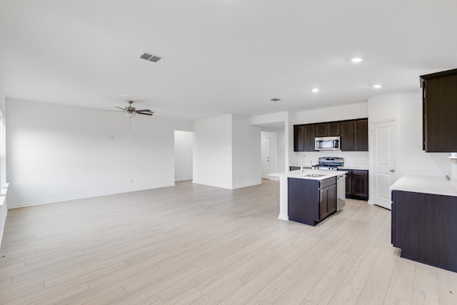 1932 Coleto Rd, Crandall, TX 75114 - kitchen with stainless steel appliances, a sink, open floor plan, recessed lighting, and ceiling fan