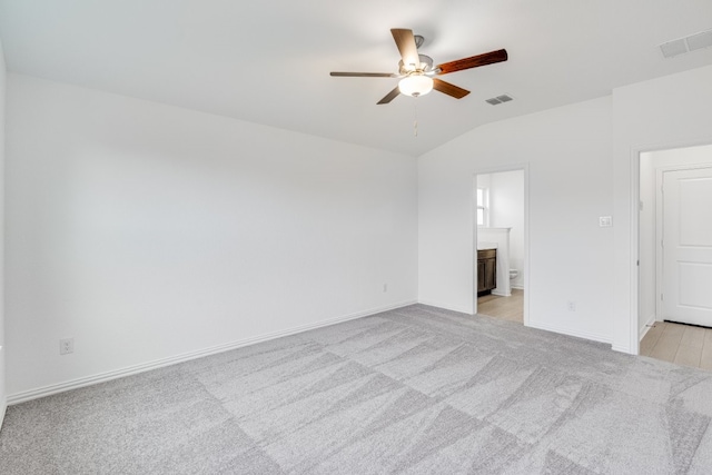 1932 Coleto Rd, Crandall, TX 75114 - unfurnished room with light carpet, a ceiling fan, vaulted ceiling, and baseboards