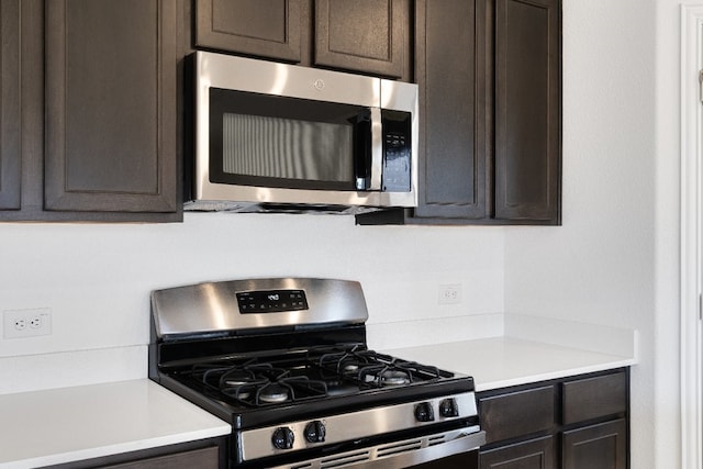 1932 Coleto Rd, Crandall, TX 75114 - kitchen featuring stainless steel appliances, light countertops, and dark brown cabinets