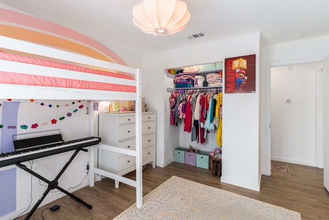 1236 Richland Oaks Dr, Richardson, TX 75081 - bedroom with wood finished floors, a closet, and baseboards