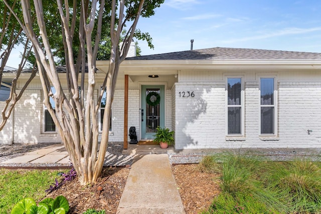 1236 Richland Oaks Dr, Richardson, TX 75081 - view of front facade with brick siding and roof with shingles