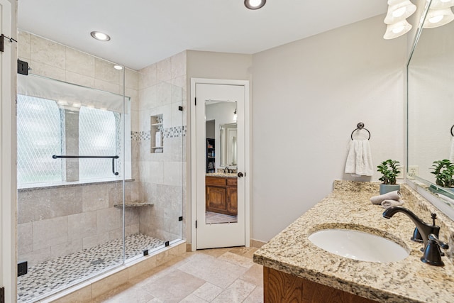 140 Amory Dr, Benbrook, TX 76126 - bathroom featuring a shower stall, vanity, stone tile floors, and recessed lighting