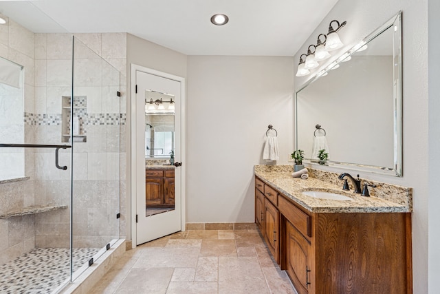 140 Amory Dr, Benbrook, TX 76126 - full bath featuring vanity, a shower stall, baseboards, stone tile floors, and recessed lighting