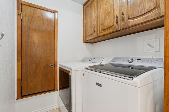 140 Amory Dr, Benbrook, TX 76126 - laundry area featuring washing machine and dryer and cabinet space