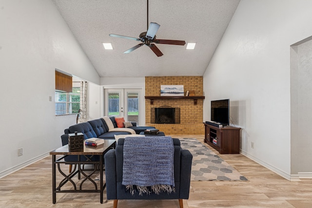 140 Amory Dr, Benbrook, TX 76126 - living area with ceiling fan, high vaulted ceiling, light wood-style floors, a textured ceiling, and baseboards