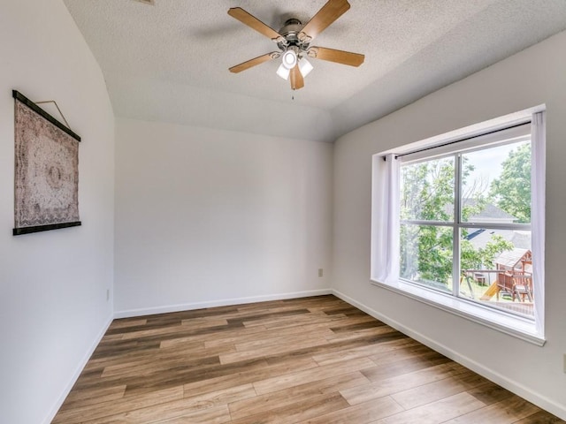 750 Pulitzer Ln, Allen, TX 75002 - unfurnished room featuring wood finished floors, ceiling fan, a textured ceiling, and baseboards
