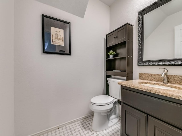 750 Pulitzer Ln, Allen, TX 75002 - half bathroom with toilet, vanity, tile patterned floors, and baseboards