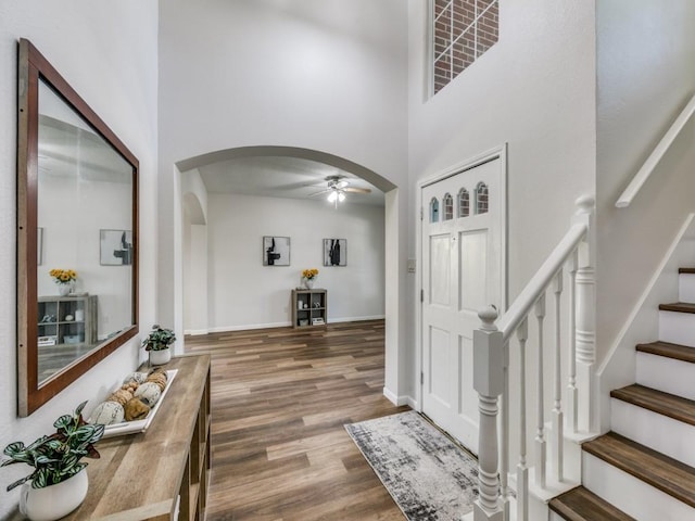750 Pulitzer Ln, Allen, TX 75002 - foyer with arched walkways, a ceiling fan, wood finished floors, a towering ceiling, and stairway