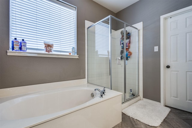 8405 White Stallion Trl, Mckinney, TX 75070 - bathroom featuring a bath, a stall shower, and baseboards