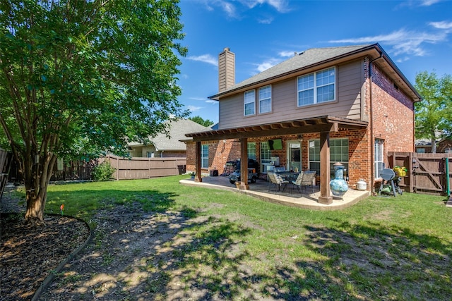 8405 White Stallion Trl, Mckinney, TX 75070 - back of property featuring brick siding, a chimney, a patio area, and a gate