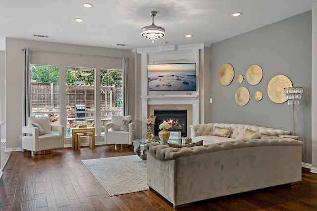 1912 White Oak Rd, Mckinney, TX 75072 - living room with dark wood-style floors, recessed lighting, a tiled fireplace, and baseboards