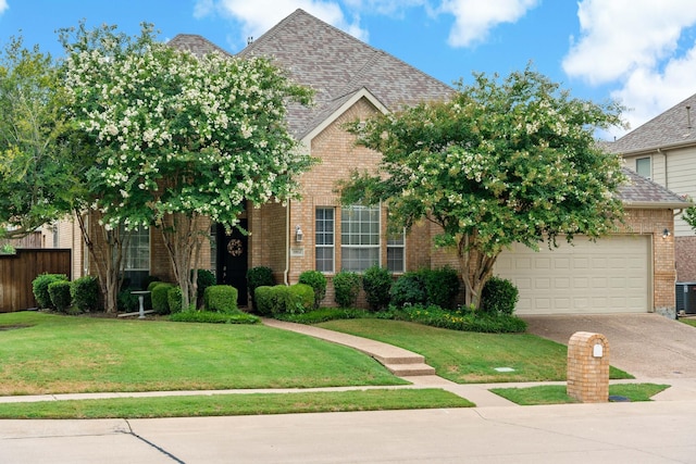 1912 White Oak Rd, Mckinney, TX 75072 - view of front of home featuring brick siding, driveway, a front lawn, an attached garage, and cooling unit