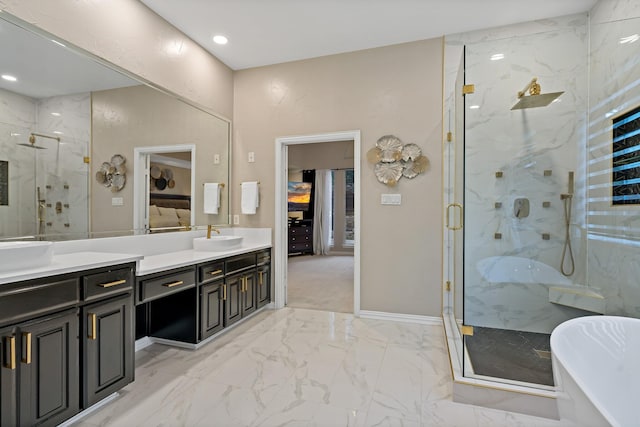 1912 White Oak Rd, Mckinney, TX 75072 - bathroom featuring a marble finish shower, vanity, marble finish flooring, a soaking tub, and baseboards
