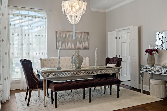 1912 White Oak Rd, Mckinney, TX 75072 - dining area with ornamental molding, a chandelier, and wood finished floors