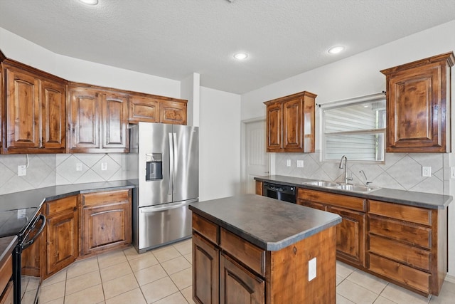 3512 Hornbeam St, Denton, TX 76226 - kitchen with black appliances, dark countertops, backsplash, recessed lighting, and a textured ceiling